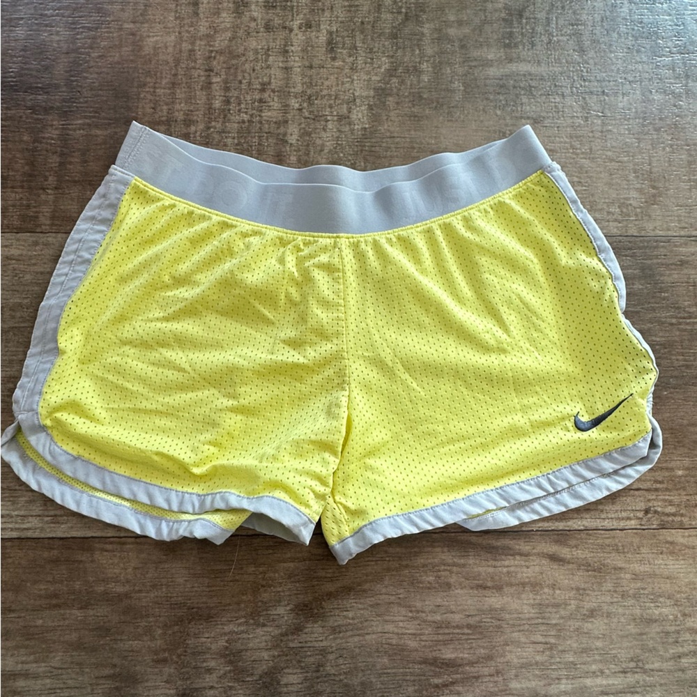 Nike yellow mesh shorts with gray trim